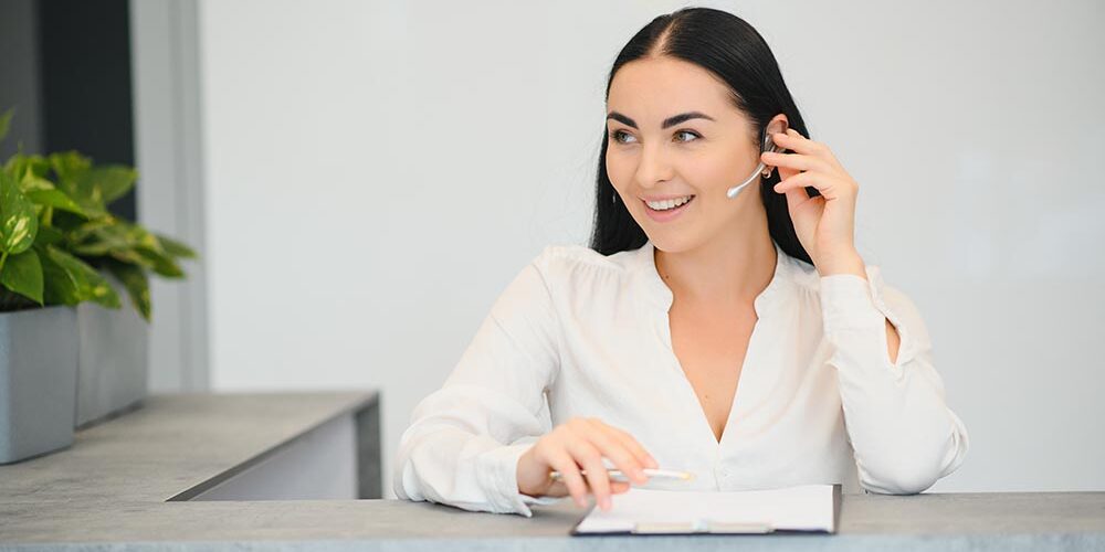 Eyelid Pros front desk scheduler assisting patients who use the online book by location tool.
